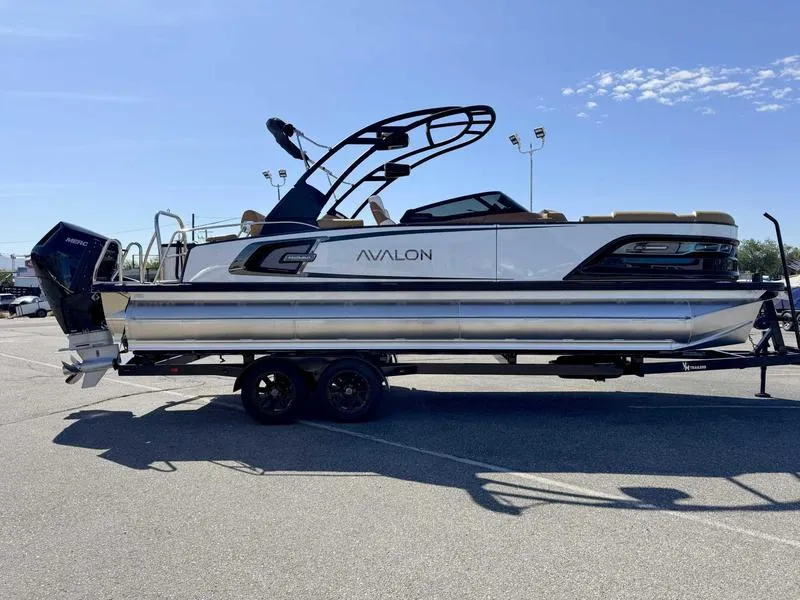 Slide: The Image of 2025 Avalon 2585 27-3 Excalibur LTD QL pontoon boat on trailer, sunny day. - 15