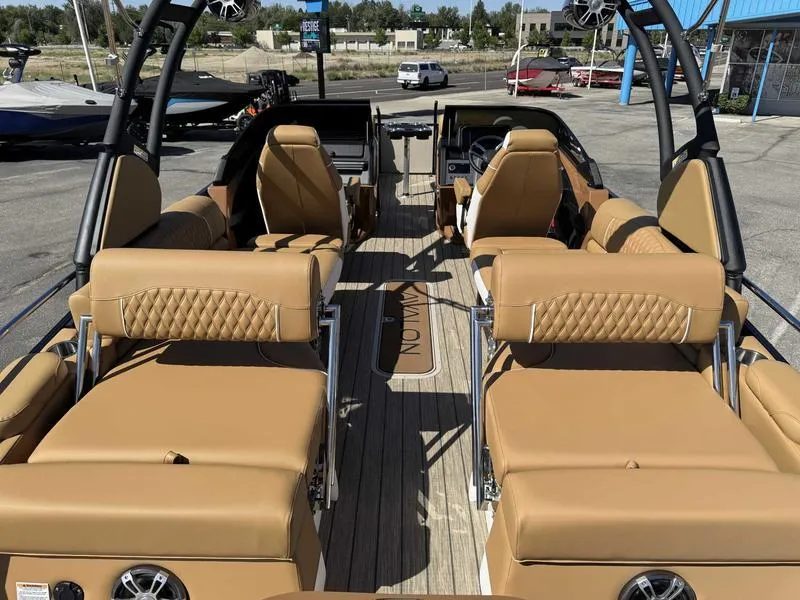 Slide: The Image of 2025 Avalon 2585 27-3 Excalibur LTD QL boat interior with tan leather seating and modern design. - 2