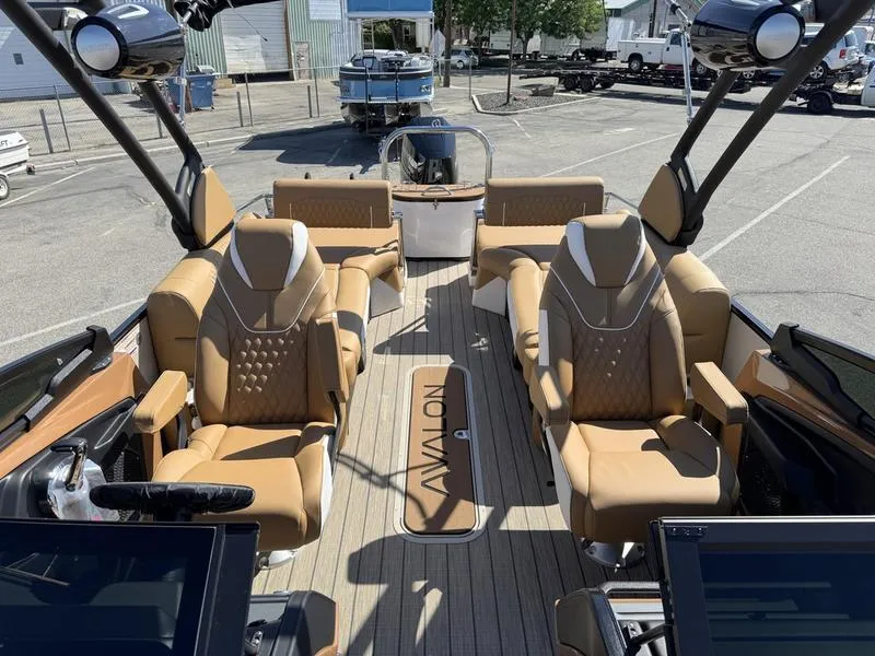 Slide: The Image of Luxurious 2025 Avalon 2585 27-3 Excalibur LTD QL boat interior with plush seating. - 8