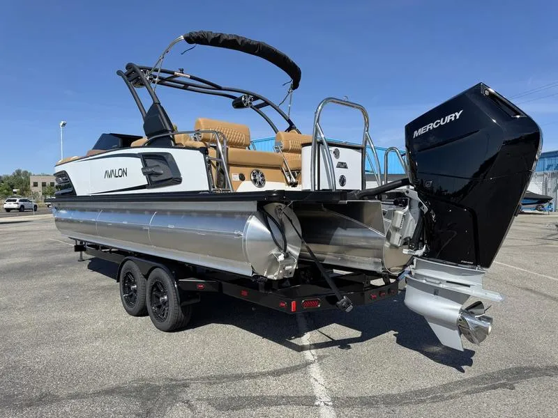 Slide: The Image of 2025 Avalon 2585 27-3 Excalibur LTD QL pontoon boat on trailer, featuring Mercury outboard motor. - 9