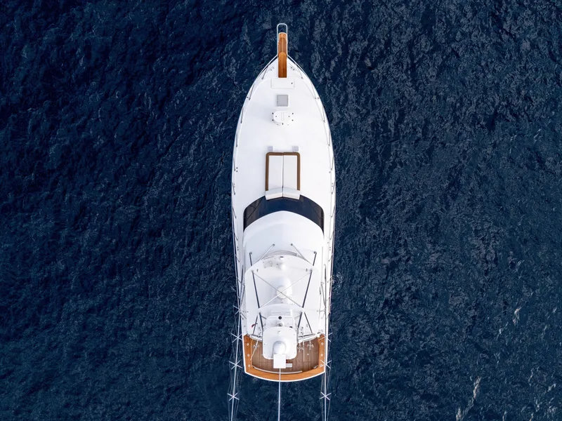 Slide: The Image of Aerial view of 2010 Hatteras 60 Convertible yacht on deep blue ocean. - 10