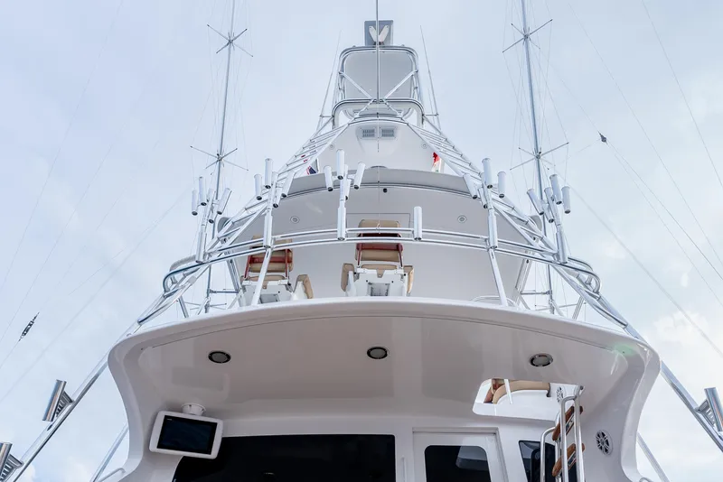 Slide: The Image of 2010 Hatteras 60 Convertible yacht, view of tower and rigging against cloudy sky. - 14
