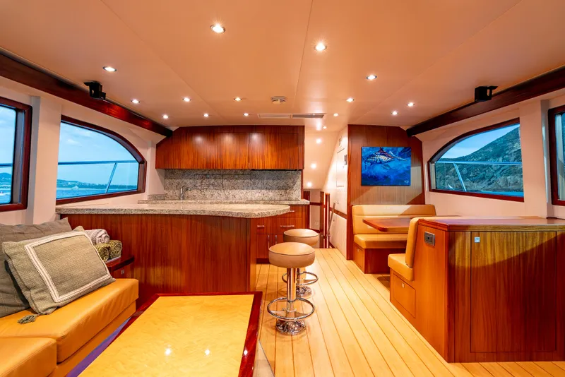 Slide: The Image of Luxurious interior of 2010 Hatteras 60 Convertible yacht with elegant wood finishes and modern amenities. - 21