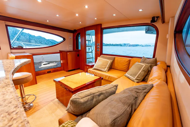 Slide: The Image of Luxurious interior of 2010 Hatteras 60 Convertible yacht with leather seating and ocean view. - 23