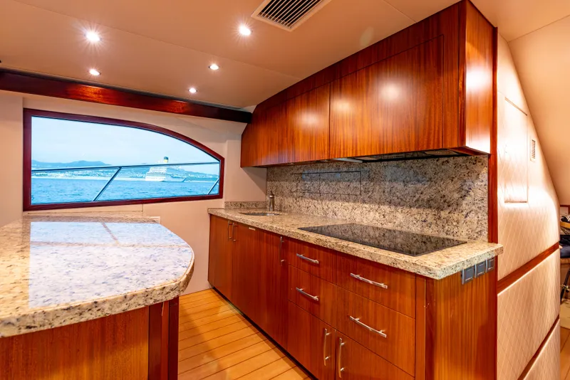 Slide: The Image of Luxurious kitchen interior of 2010 Hatteras 60 Convertible yacht with granite countertops. - 25