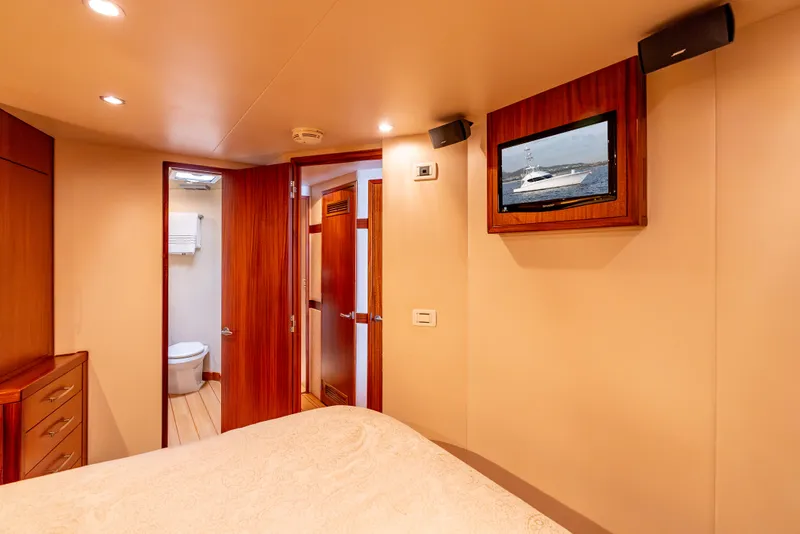 Slide: The Image of Luxurious cabin interior of 2010 Hatteras 60 Convertible yacht with TV and ensuite bathroom. - 34