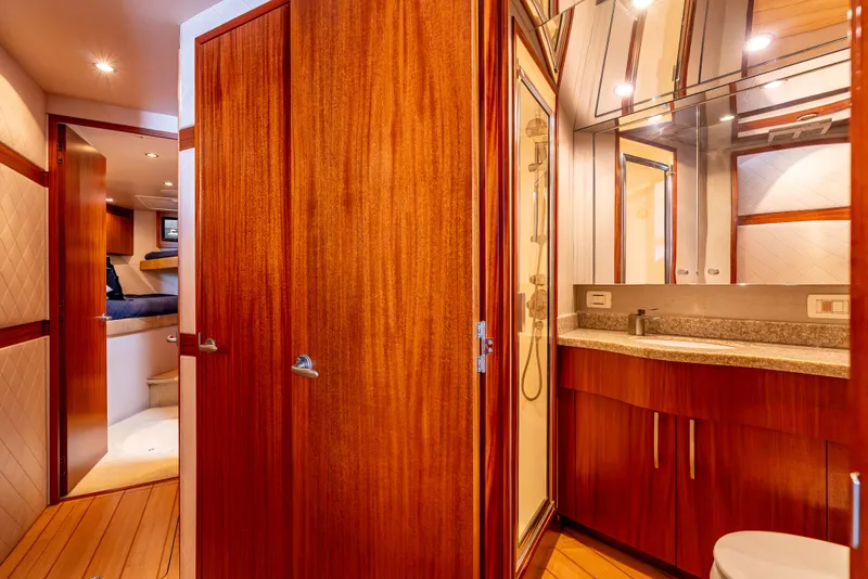Slide: The Image of Luxurious bathroom interior on 2010 Hatteras 60 Convertible yacht with wood finishes. - 39