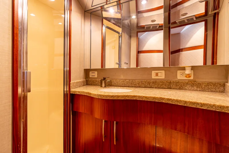 Slide: The Image of Luxurious bathroom interior of 2010 Hatteras 60 Convertible yacht with elegant wood and granite finishes. - 40