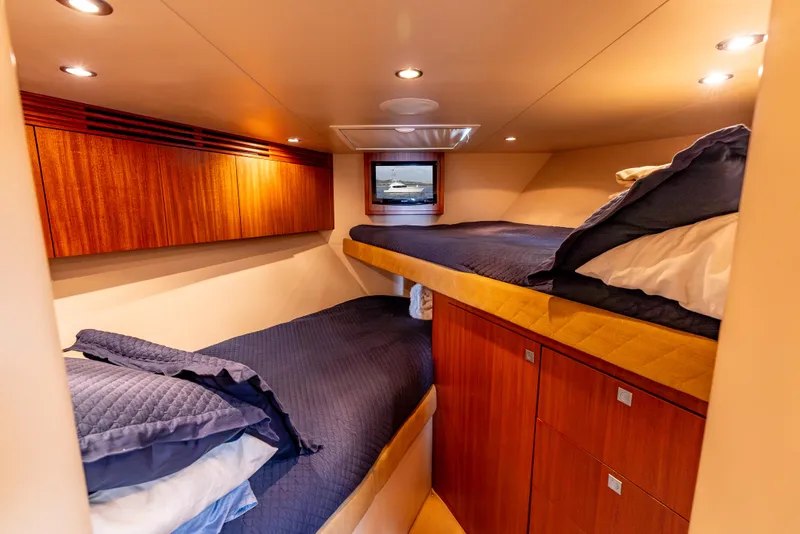 Slide: The Image of Luxurious cabin interior of 2010 Hatteras 60 Convertible yacht with cozy bunk beds. - 42