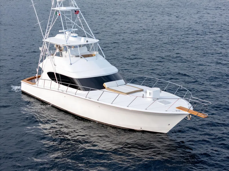 Slide: The Image of 2010 Hatteras 60 Convertible yacht cruising on open water. - 6