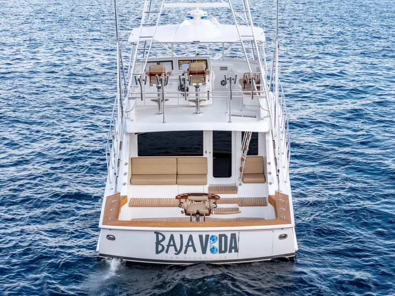 Slide: The Image of Sleek 2010 Hatteras 60 Convertible yacht on open ocean waters. - 7