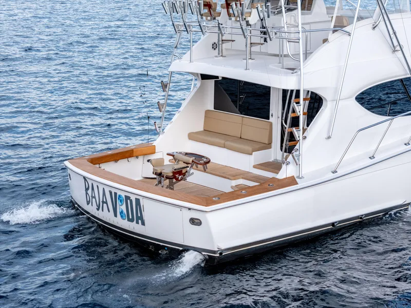 Slide: The Image of 2010 Hatteras 60 Convertible yacht cruising on open water. - 8