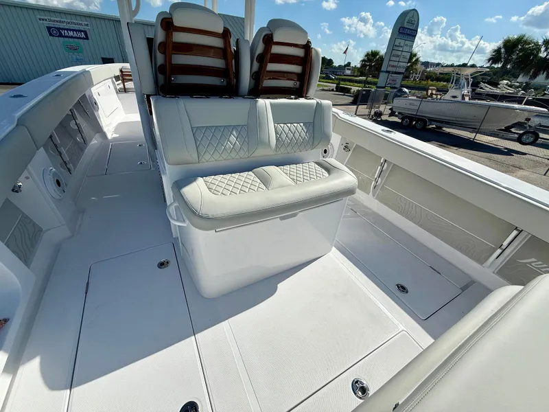 Slide: The Image of 2026 Jupiter 34 boat interior with cushioned seating and sleek design. - 9