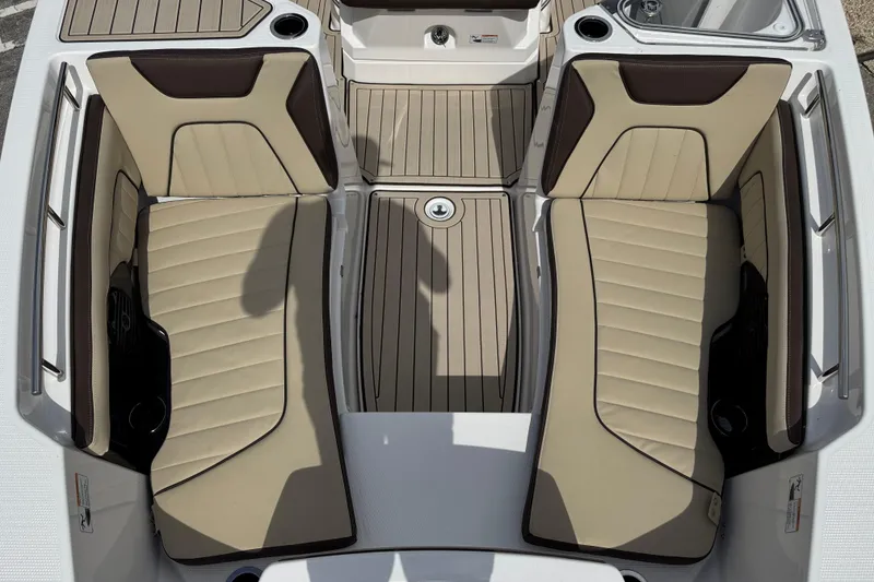 Slide: The Image of 2025 Yamaha Boats 252 FSH Sport interior with beige seating and sleek design. - 14