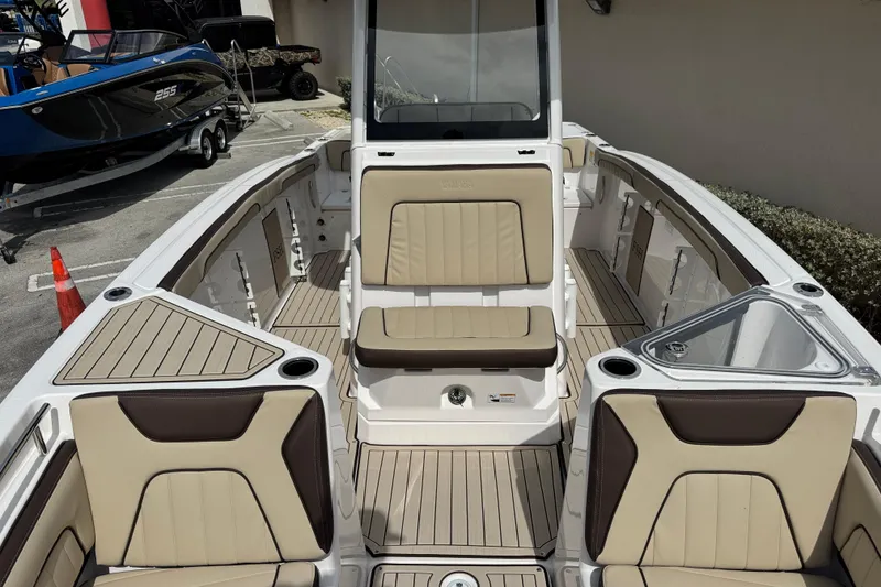 Slide: The Image of 2025 Yamaha Boats 252 FSH Sport interior with beige seating and modern design. - 15