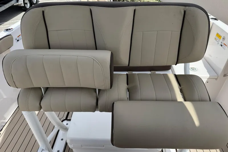 Slide: The Image of 2025 Yamaha Boats 252 FSH Sport seating, featuring beige cushioned upholstery and sleek design. - 22