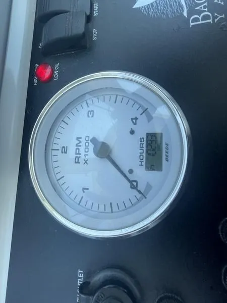 Slide: The Image of RPM gauge of a 2006 Back Cove 29 boat, displaying engine hours. - 23