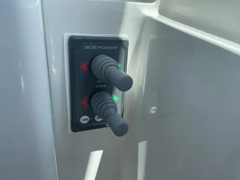 Slide: The Image of Control panel with joysticks on a 2006 Back Cove 29 boat. - 25