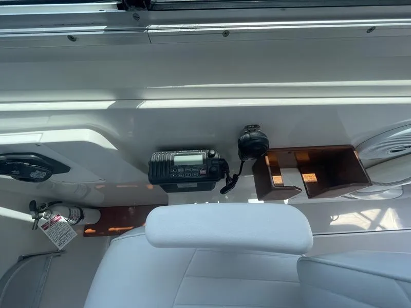 Slide: The Image of Interior of a 2006 Back Cove 29 boat showing radio equipment and seating. - 26