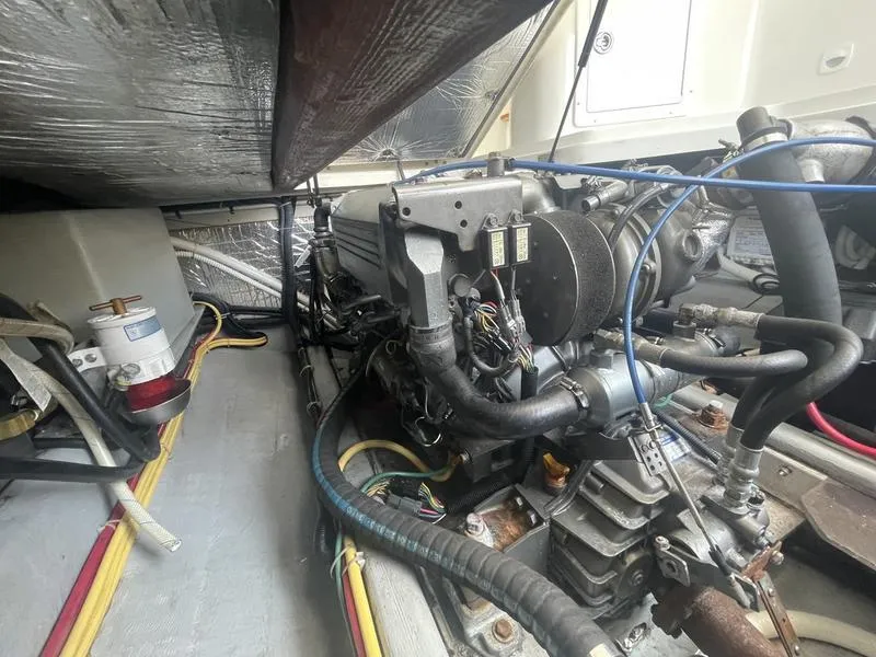 Slide: The Image of Engine compartment of a 2006 Back Cove 29 boat, showcasing detailed mechanical components. - 31