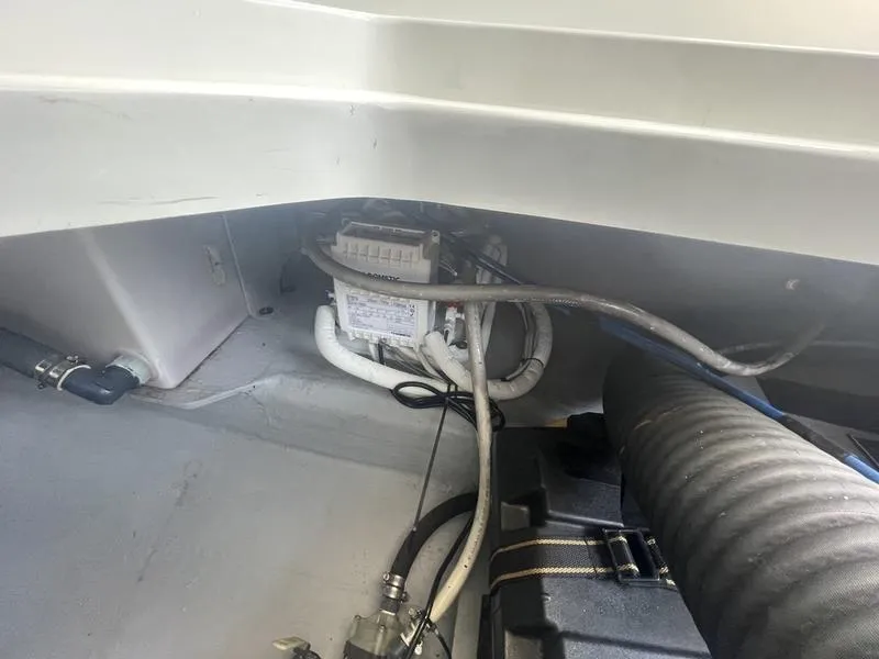 Slide: The Image of 2006 Back Cove 29 boat interior showing wiring and components. - 32