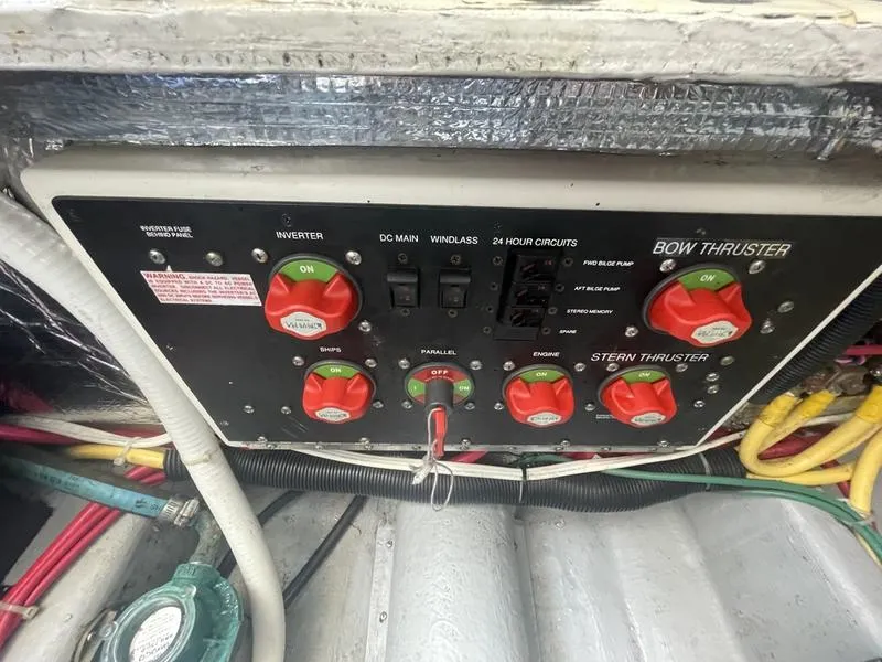 Slide: The Image of Control panel of a 2006 Back Cove 29 boat with switches and wiring. - 36