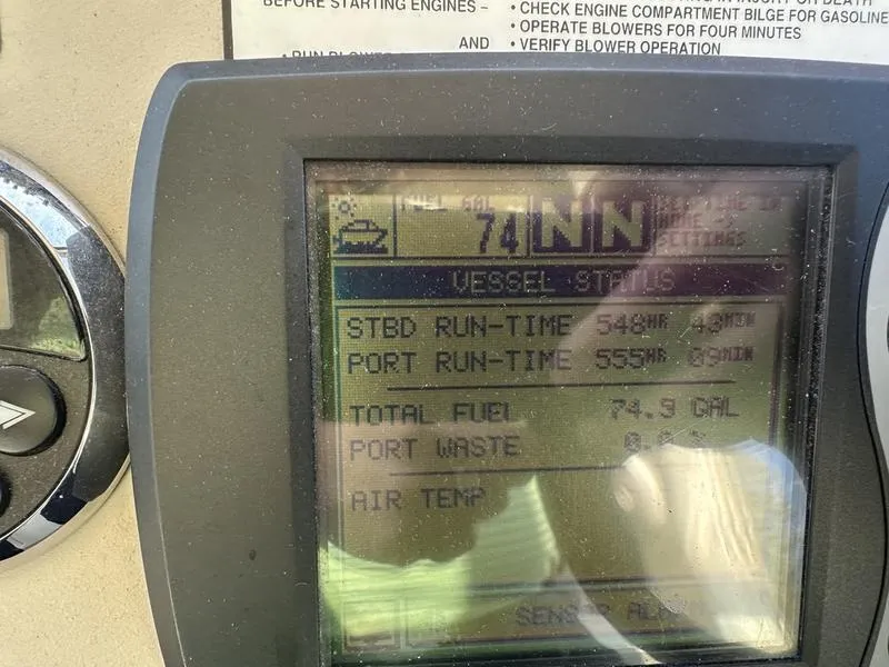 Slide: The Image of Display screen of 2007 Sea Ray 300 Sundancer showing vessel status and fuel data. - 12