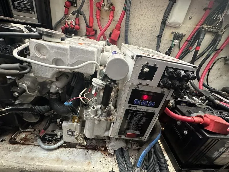 Slide: The Image of Engine compartment of a 2007 Sea Ray 300 Sundancer with wiring and control panel. - 8