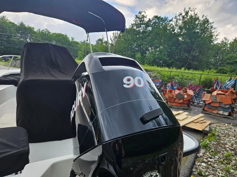 Slide: The Image of 2008 Boston Whaler 170 Montauk with Mercury 90 outboard engine, parked outdoors. - 11