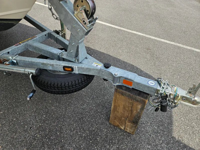 Slide: The Image of Trailer hitch of a 2008 Boston Whaler 170 Montauk on a wooden block. - 15