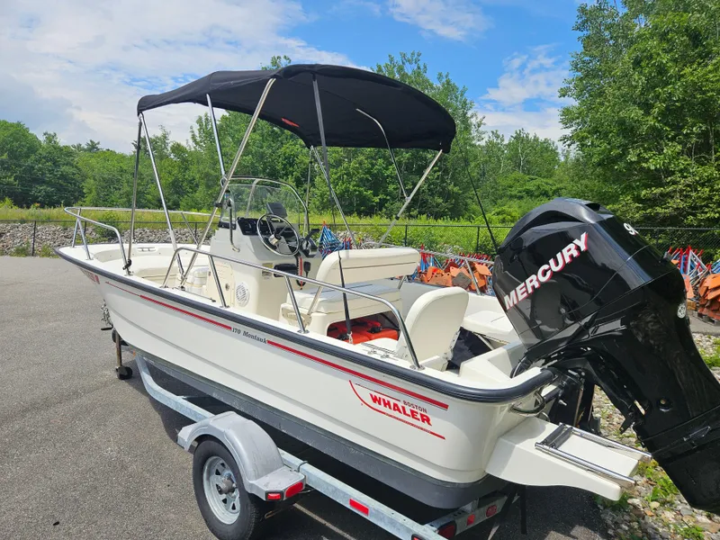 Slide: The Image of 2008 Boston Whaler 170 Montauk boat with Mercury engine on a trailer. - 16