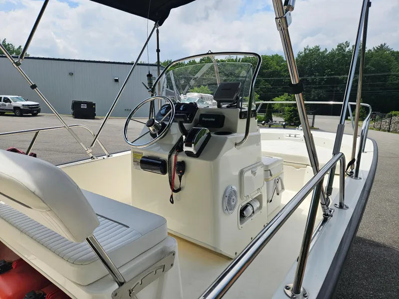 Slide: The Image of 2008 Boston Whaler 170 Montauk boat interior with steering console and seating. - 18