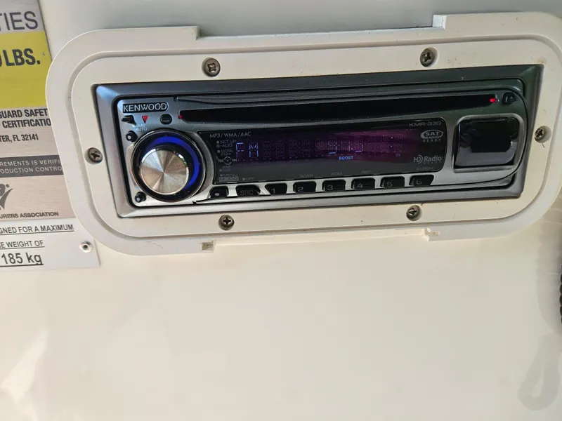 Slide: The Image of Kenwood stereo system on 2008 Boston Whaler 170 Montauk boat dashboard. - 27