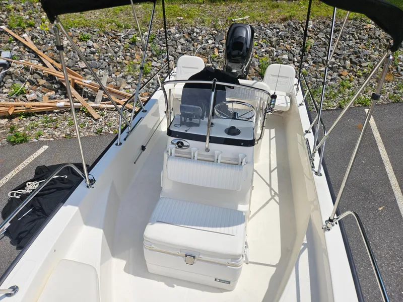 Slide: The Image of 2008 Boston Whaler 170 Montauk boat interior with seating and steering console. - 29
