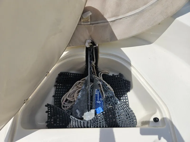 Slide: The Image of Anchor storage compartment on a 2008 Boston Whaler 170 Montauk boat. - 31