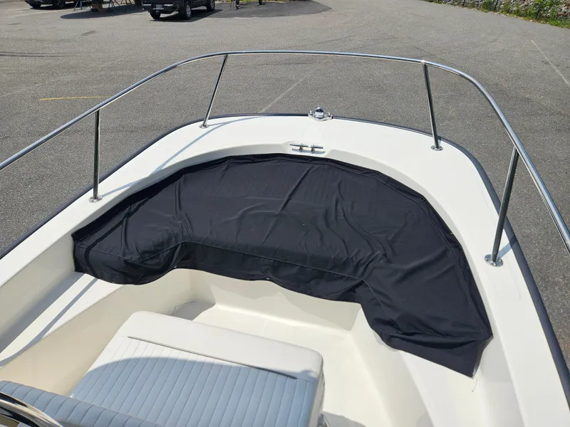 Slide: The Image of 2008 Boston Whaler 170 Montauk boat bow with black cover and railing. - 33