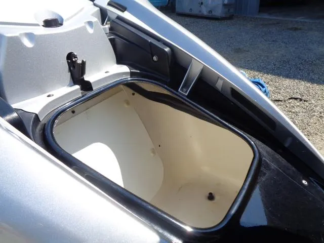 Slide: The Image of 2007 Yamaha WaveRunner FX HO storage compartment, open and empty, on a sunny day. - 3