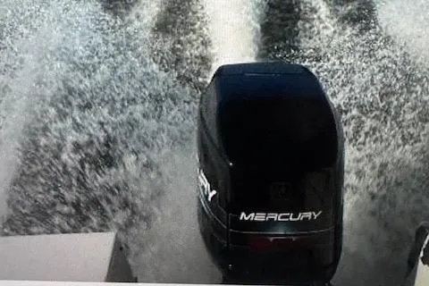 Slide: The Image of 1997 Sea Ray Laguna 21 with Mercury outboard motor creating water spray. - 10
