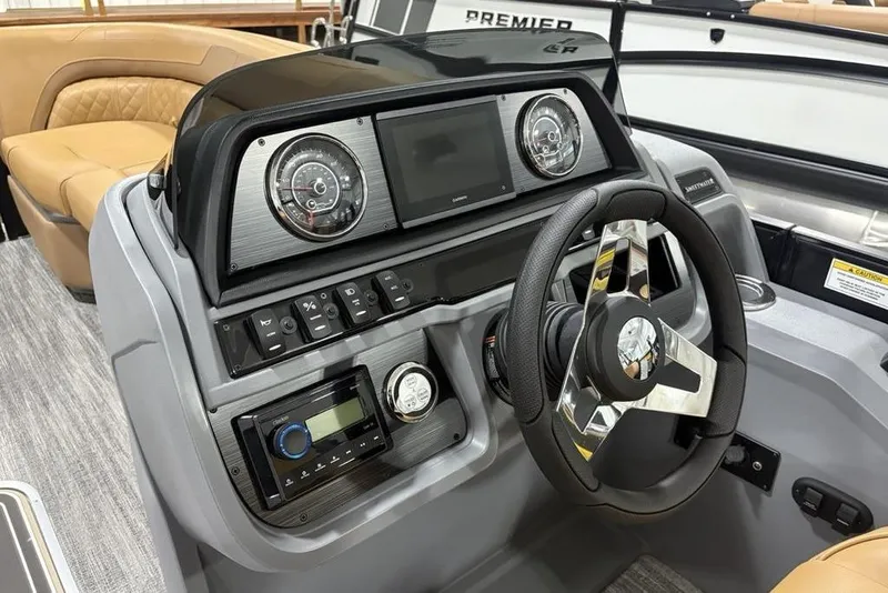 Slide: The Image of 2025 Godfrey Sweetwater 2286 SFL iMPACT boat dashboard with modern controls and steering wheel. - 17