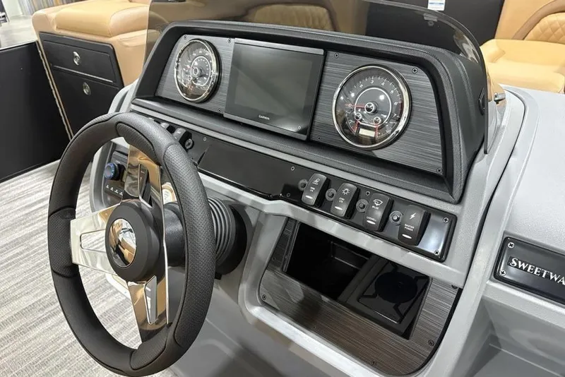 Slide: The Image of 2025 Godfrey Sweetwater 2286 SFL iMPACT boat dashboard with steering wheel and controls. - 21