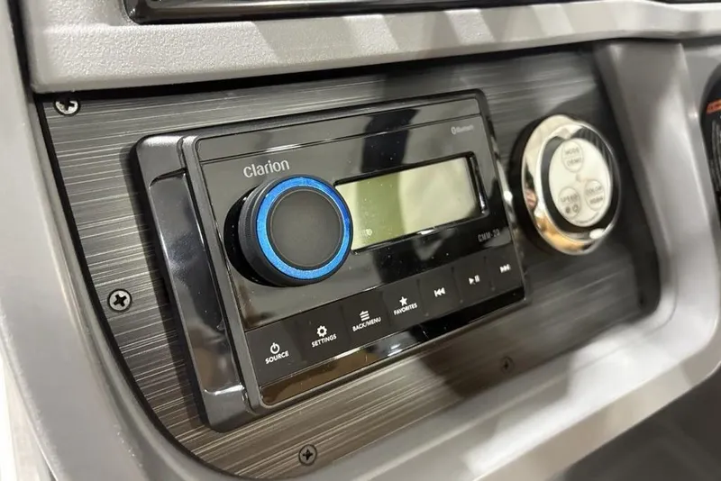 Slide: The Image of Clarion audio system in 2025 Godfrey Sweetwater 2286 SFL iMPACT boat dashboard. - 24
