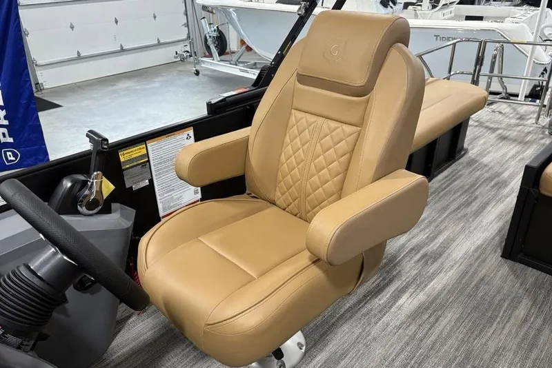Slide: The Image of Luxurious tan captain's chair in 2025 Godfrey Sweetwater 2286 SFL iMPACT pontoon boat. - 25
