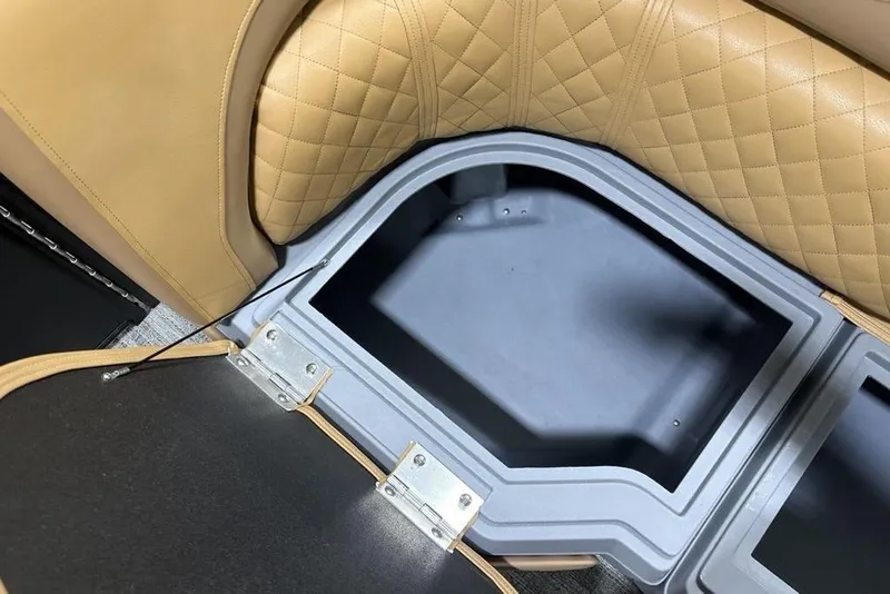Slide: The Image of Storage compartment in 2025 Godfrey Sweetwater 2286 SFL iMPACT pontoon boat with tan quilted seating. - 7