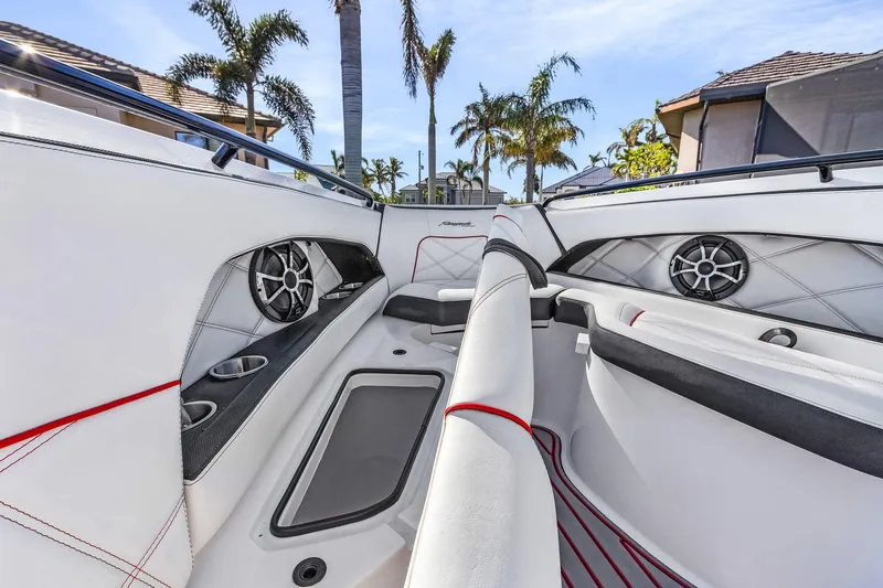 Slide: The Image of 2020 Renegade 33' Open boat interior with white seating, cup holders, and speakers. - 12