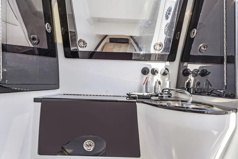 Slide: The Image of Interior view of 2020 Renegade 33' Open boat with sleek control panel and modern design. - 15