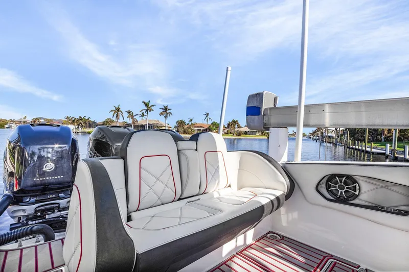 Slide: The Image of 2020 Renegade 33' Open boat interior with luxurious seating and scenic waterfront view. - 6