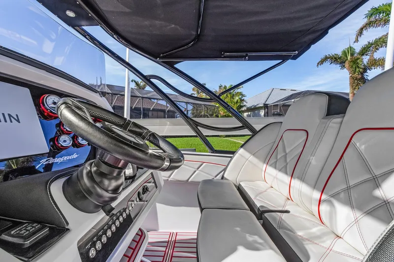 Slide: The Image of Interior of 2020 Renegade 33' Open boat with sleek steering and luxurious seating. - 8