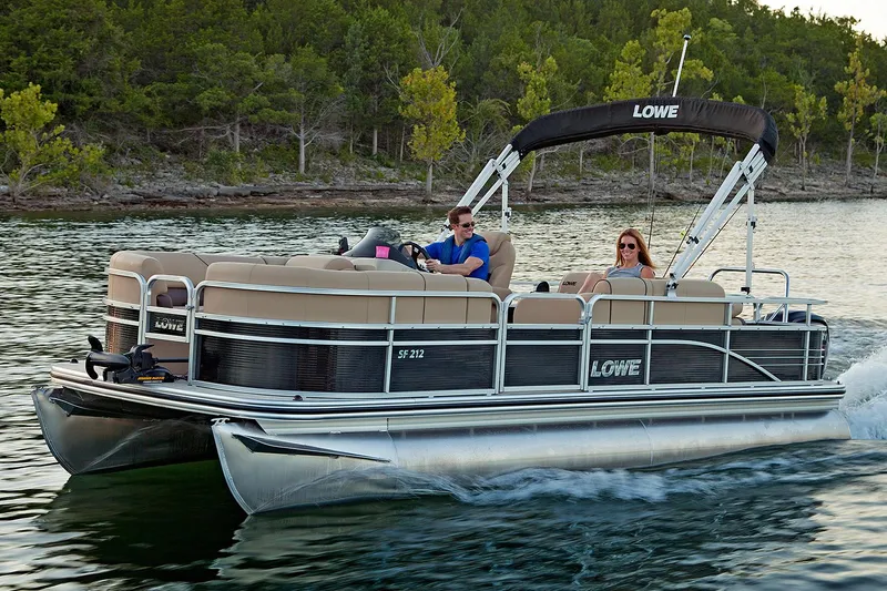 The Image of Manufacturer Provided Image: 2017 Lowe SF212 Sport Fish pontoon boat cruising on a lake. - 0