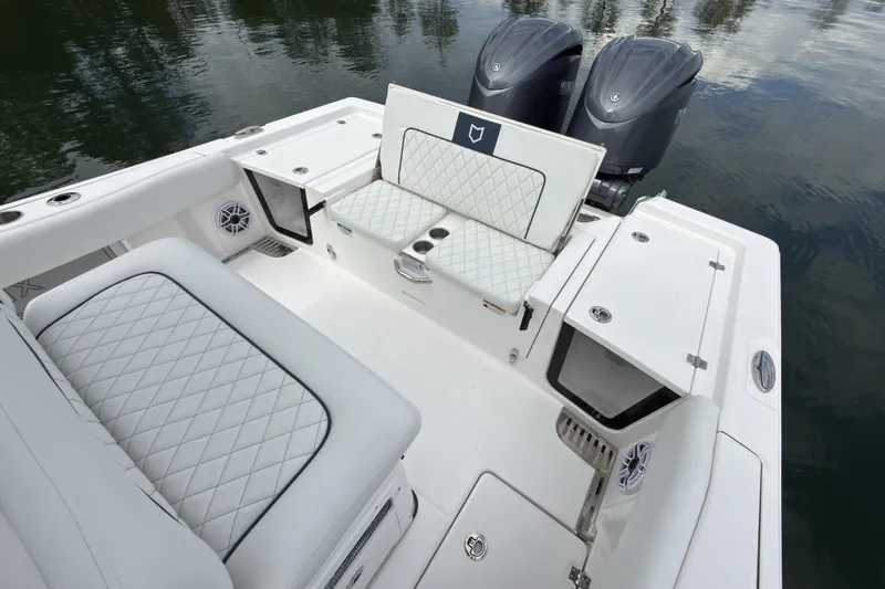 Slide: The Image of 2025 Sea Fox 282 Hybrid LT boat interior with quilted seating and dual engines. - 16