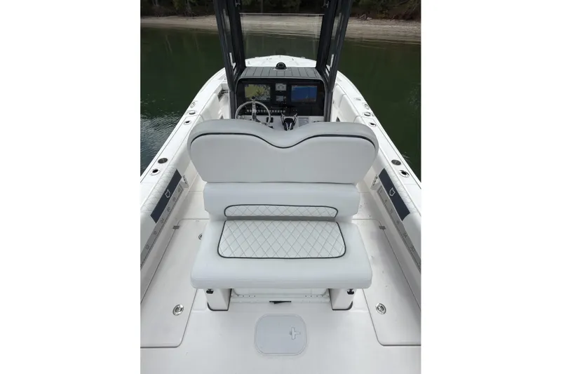 Slide: The Image of 2025 Sea Fox 282 Hybrid LT boat interior with white seating and navigation console. - 17
